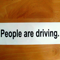 People are driving. 