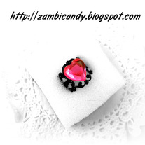 Adjustable black filligree ring with pink heart