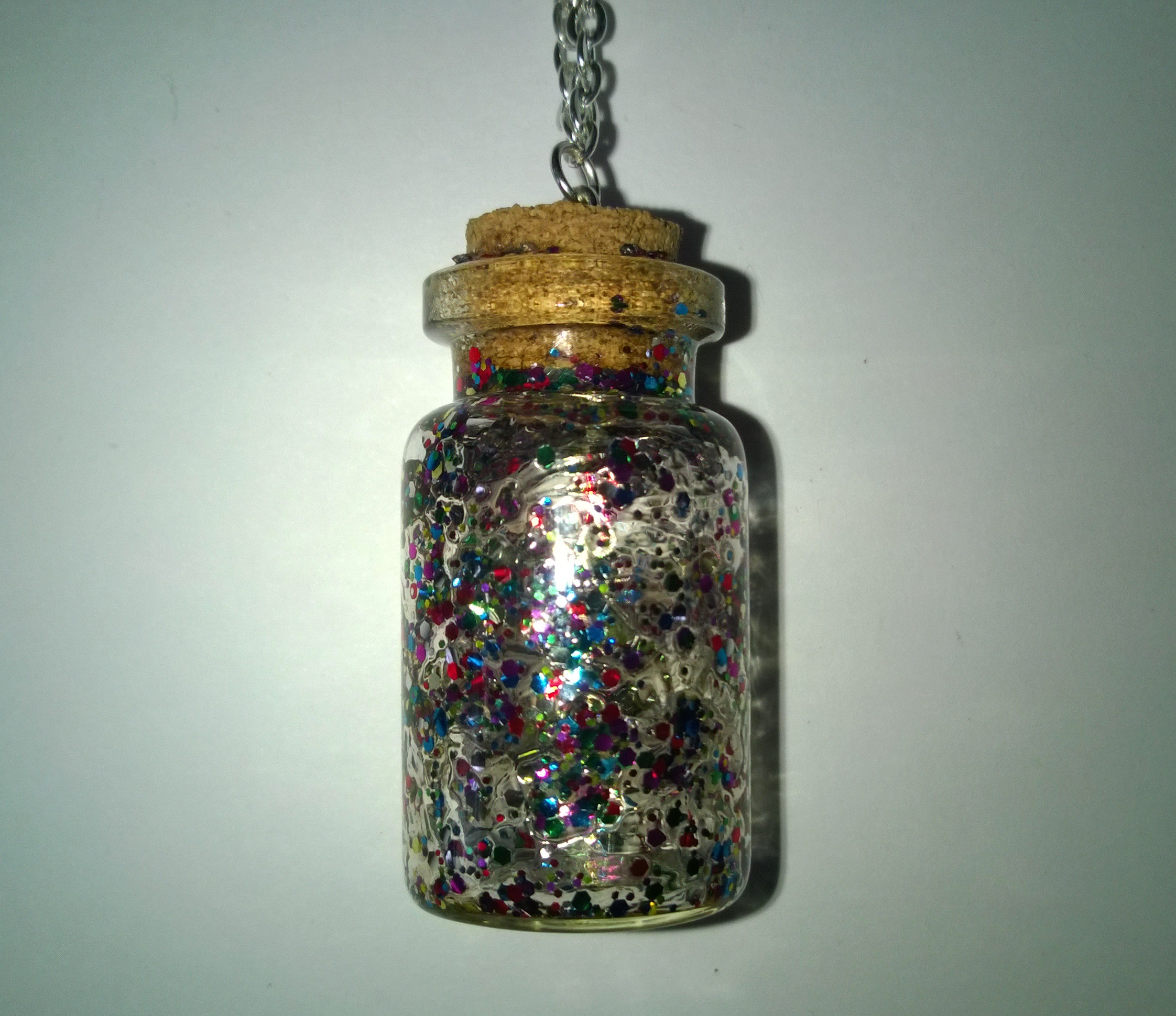 £8 Silver and multi colour Glitter potion bottle necklace on Storenvy