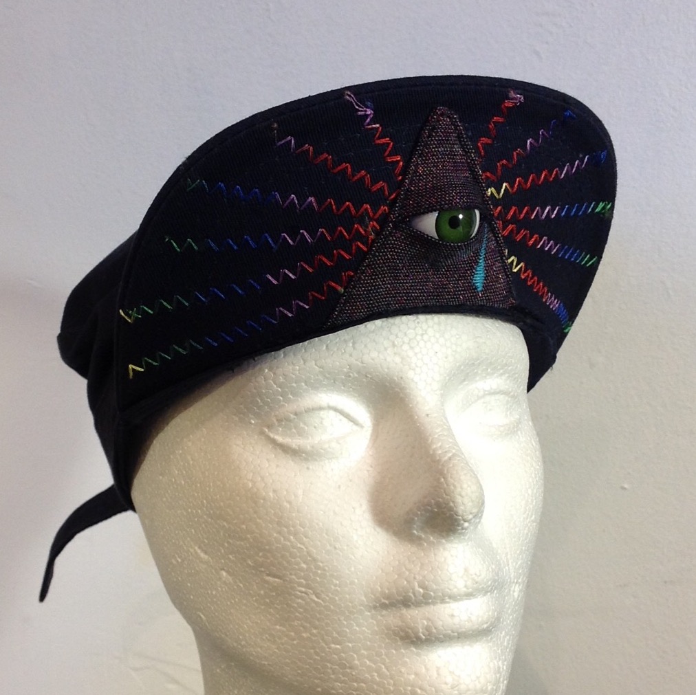 econo illuminator 003; green eye, blue cap